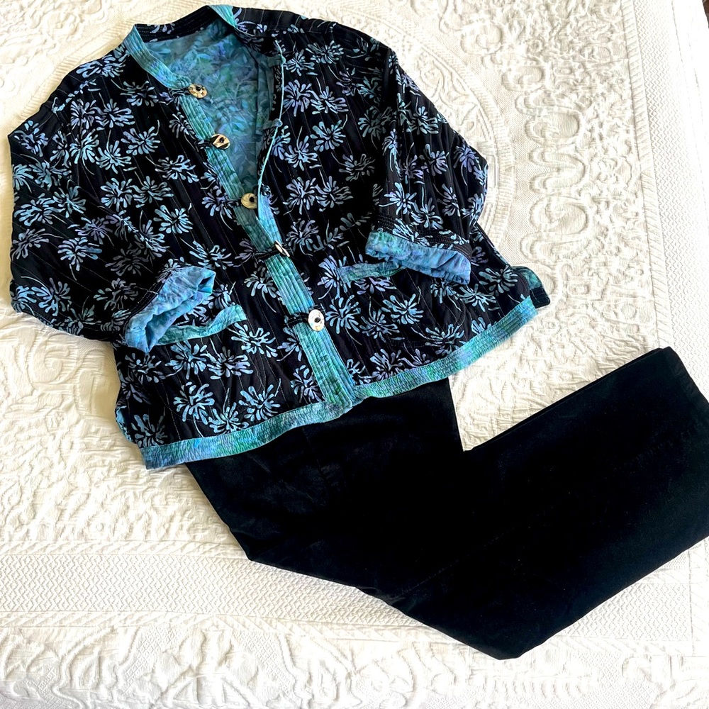 Blue and black reversible Asian style jacket with decorative buttons.